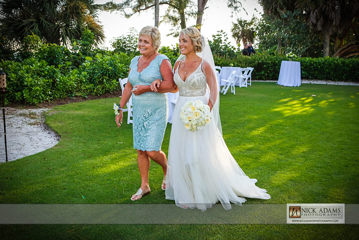 arm in arm, ceremony, mom and daughter, walk down the isle, beach wedding photography, Sanibel,