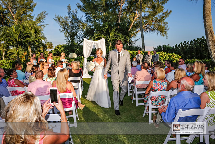 Wedding party, beach wedding photography, Sanibel, lawn, tent, marquee, outdoors , walking down the isle
